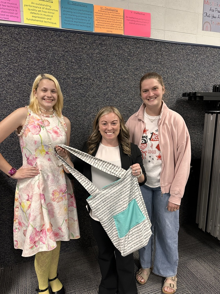 Mrs. Bailey and Ms. Grace show off student project from textiles class.