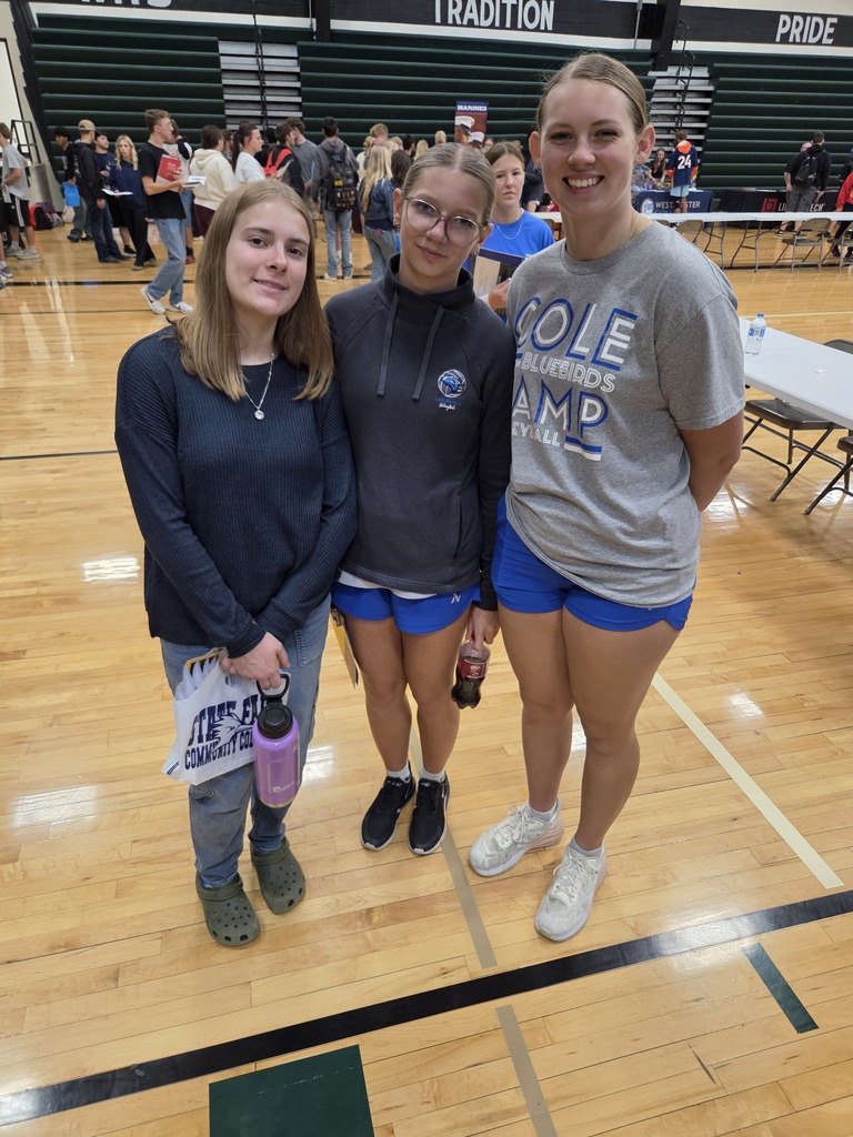 High school girls posing at the college fair.