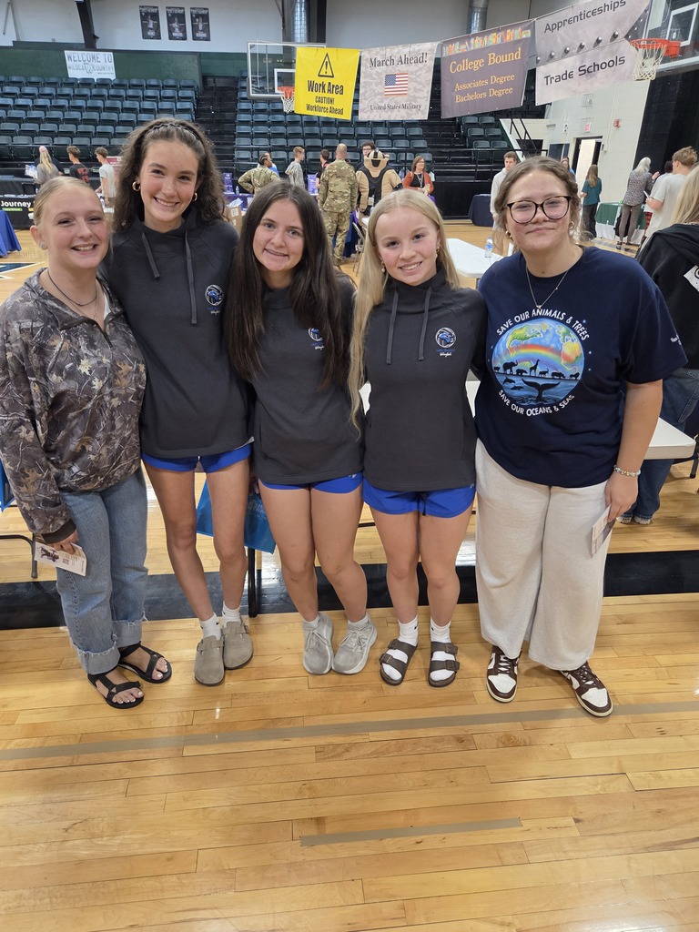 High school girls posing at the college fair.