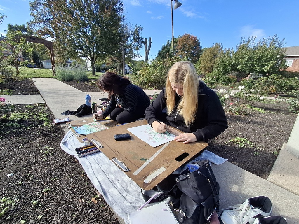 Artists Meadow Ridenour and Abby Roark working on their artworks.