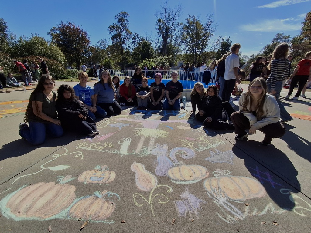 Cole Camp artists with their sidewalk chalk design based on the theme: "It's Fall, Y'all!".