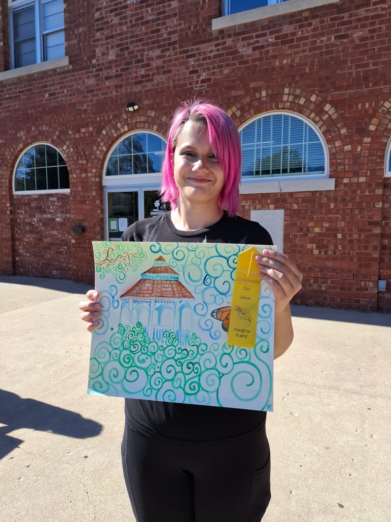 Trinity Anderson with her 4th place ribbon for her artwork of a gazebo in watercolor.