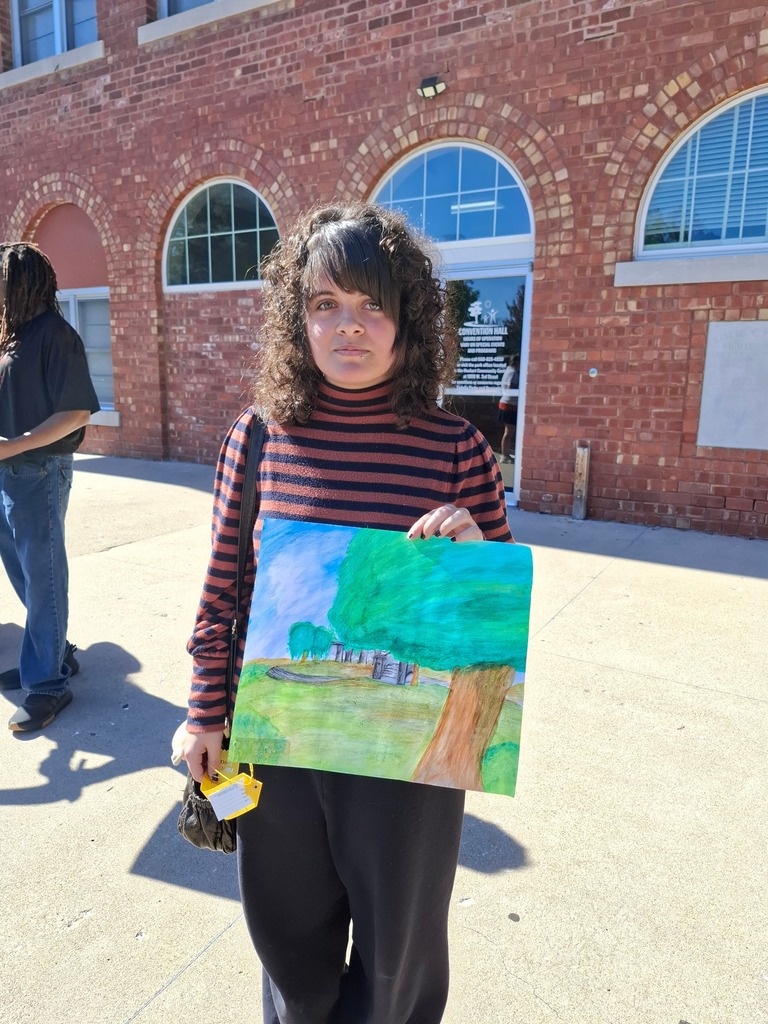 Taylor Chambless with her tree mixed media piece that received a 4th place ribbon.