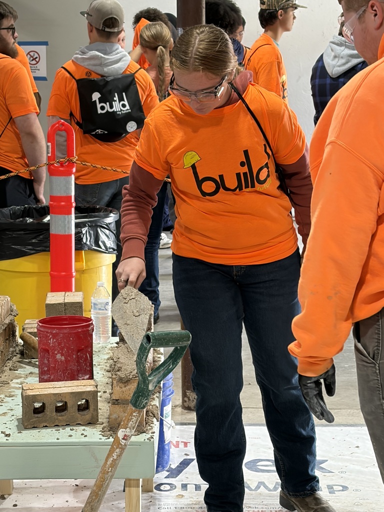 High School students learning how to construct a brick wall at Build My Future