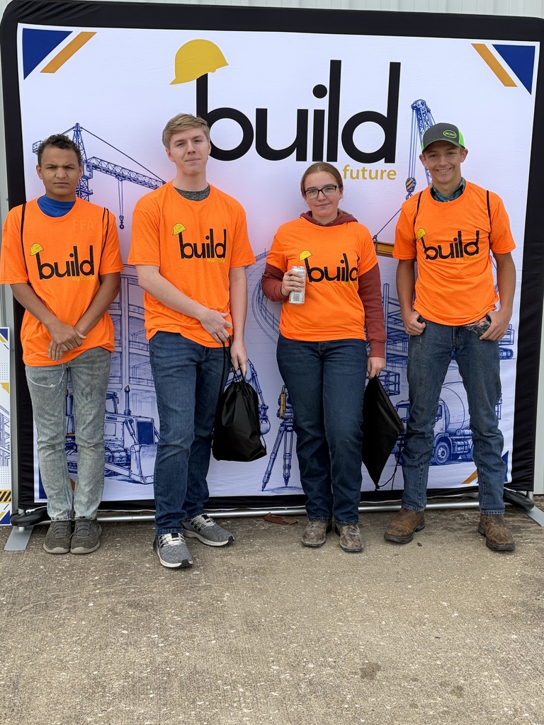 High school students standing in front of Build My Future sign