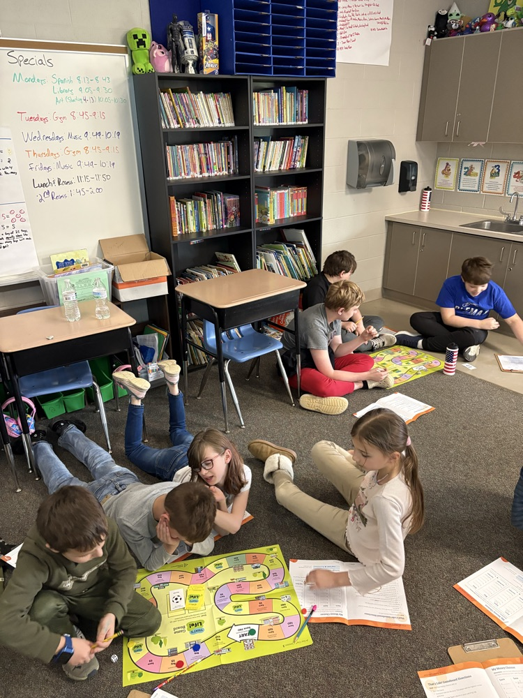 Playing That’s Life, a game about to teach about saving and spending habits
