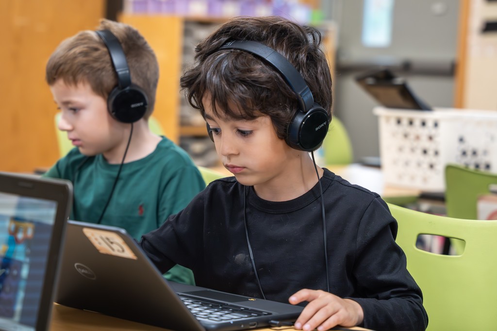 photo of child on computer