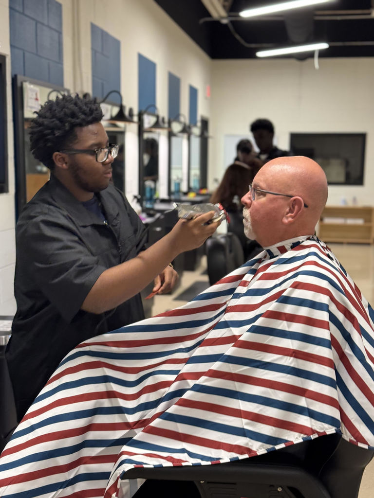Barber students practicing