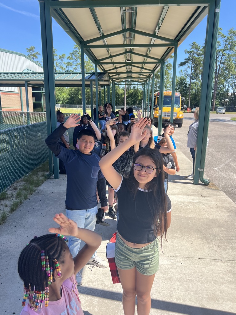 Students waving good bye.