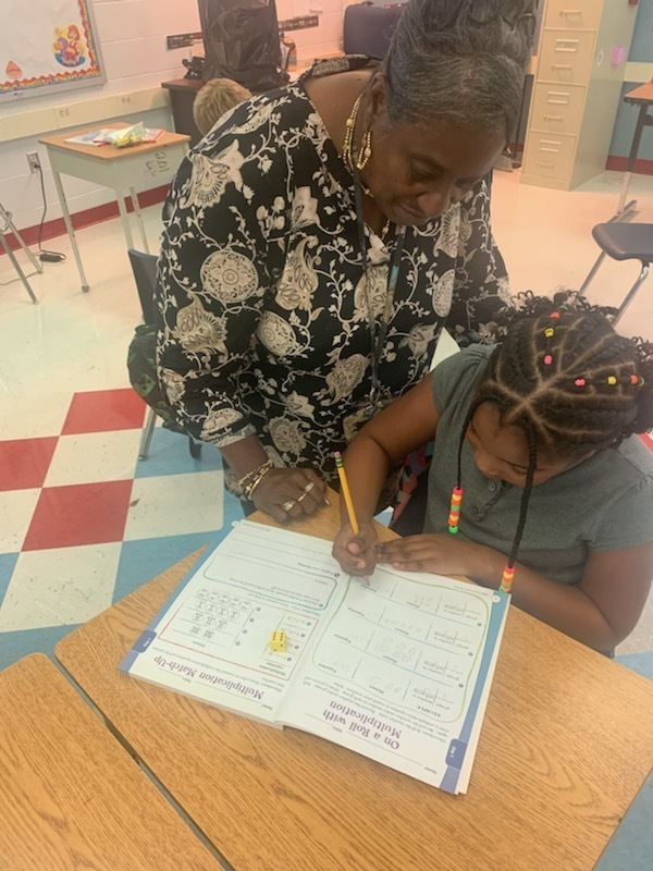 Ms. Bryant & a student working