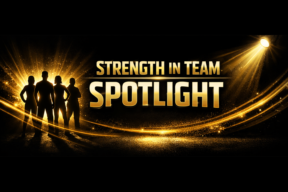 “Four silhouetted figures stand together against a radiant gold background with beams of light and sparkles. A bright spotlight shines from the upper right, illuminating the group. Bold gold text reads ‘Strength in Team Spotlight.’”