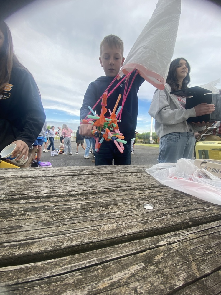 kid onnpicnic table with project