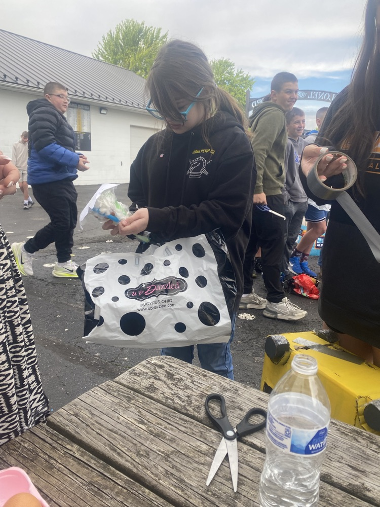 A student with their egg drop project