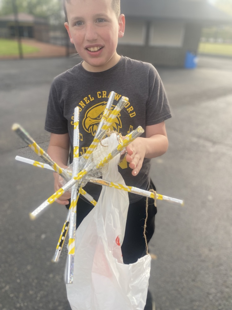 another student holding up their egg drop