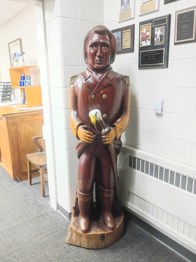 this is a wooden carved figure of Colonel Crawford with an eagle