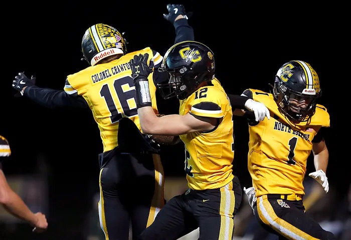 CC celebrating a touchdown at a football game 