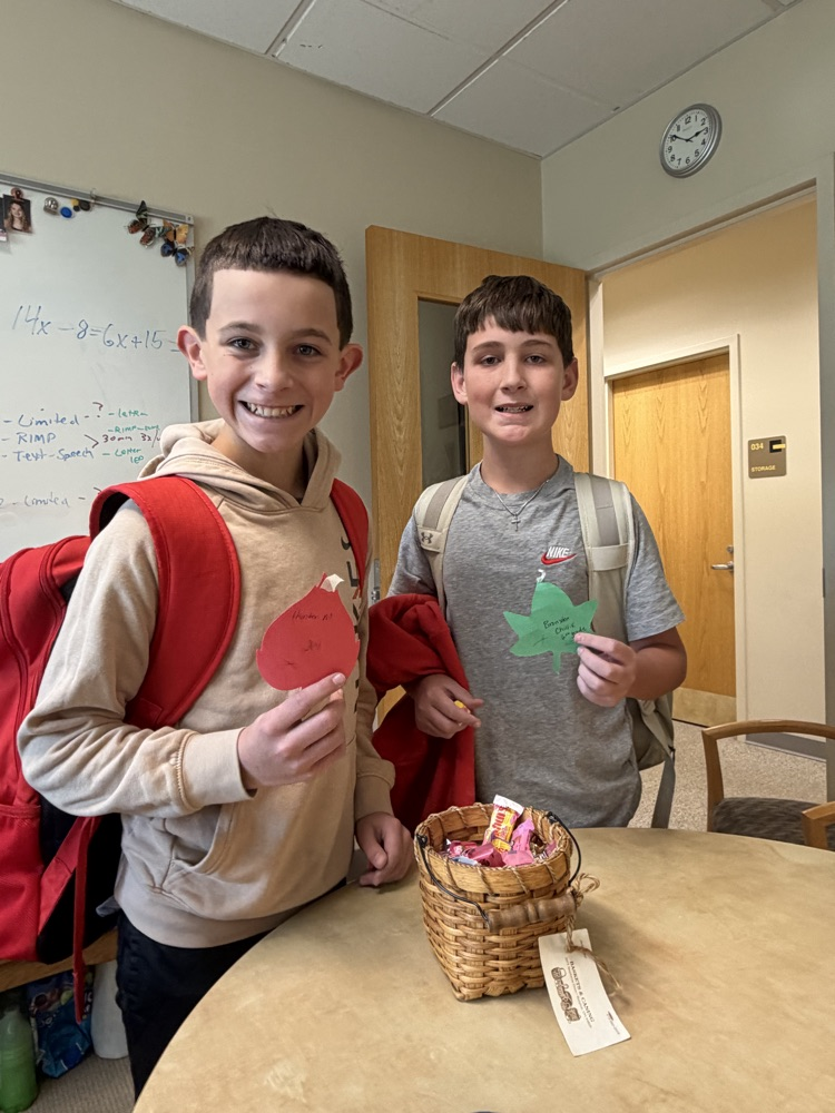 students visiting Mrs. Bond to show their notes from their teachers