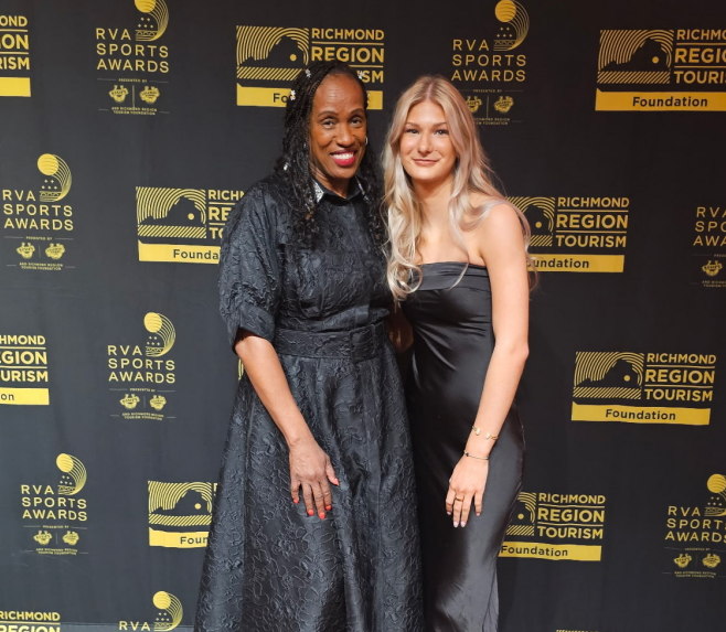 Hurly stands with Jackie-Joyner Kersee