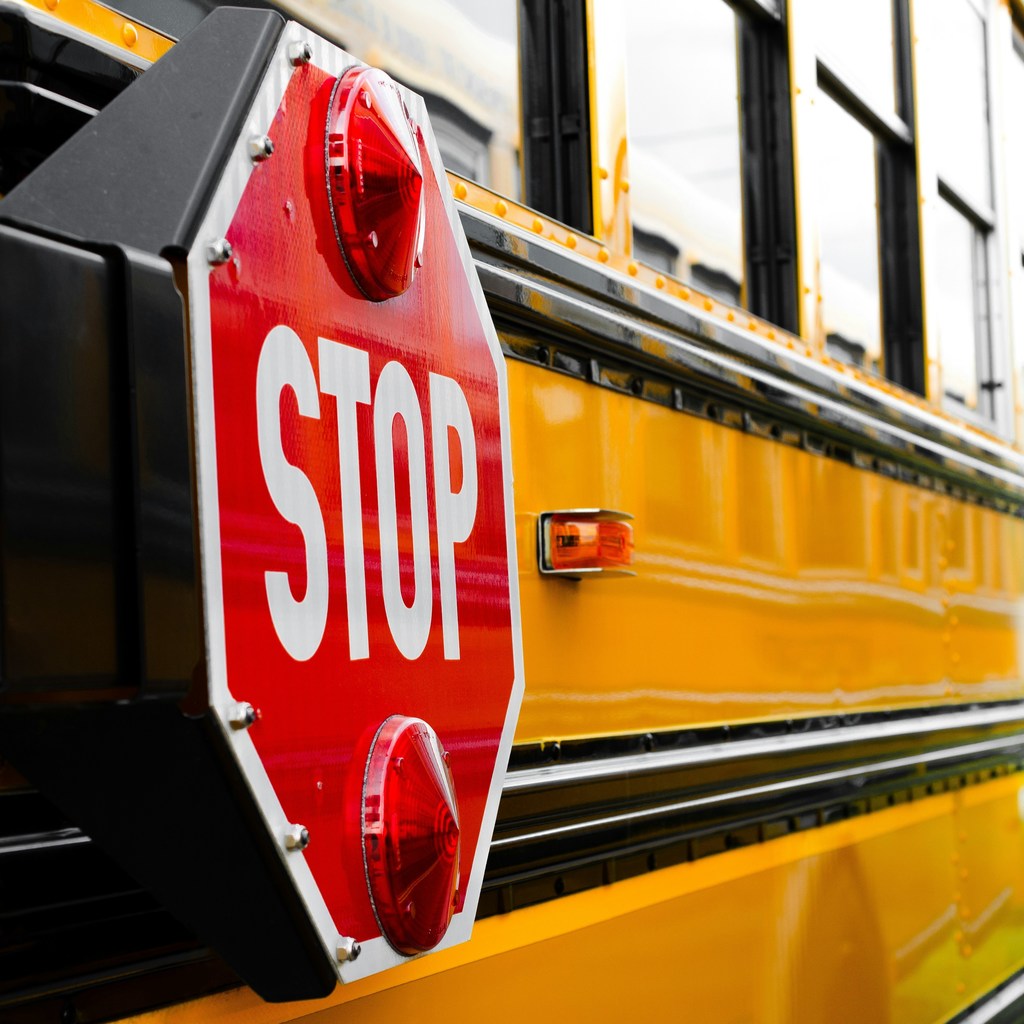 close up of school bus stop sign