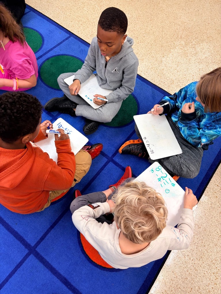 Boys Doing Math on Whiteboards