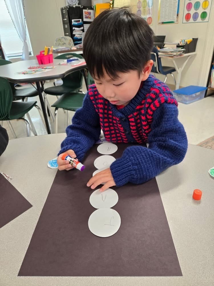 Boy working on snowman art