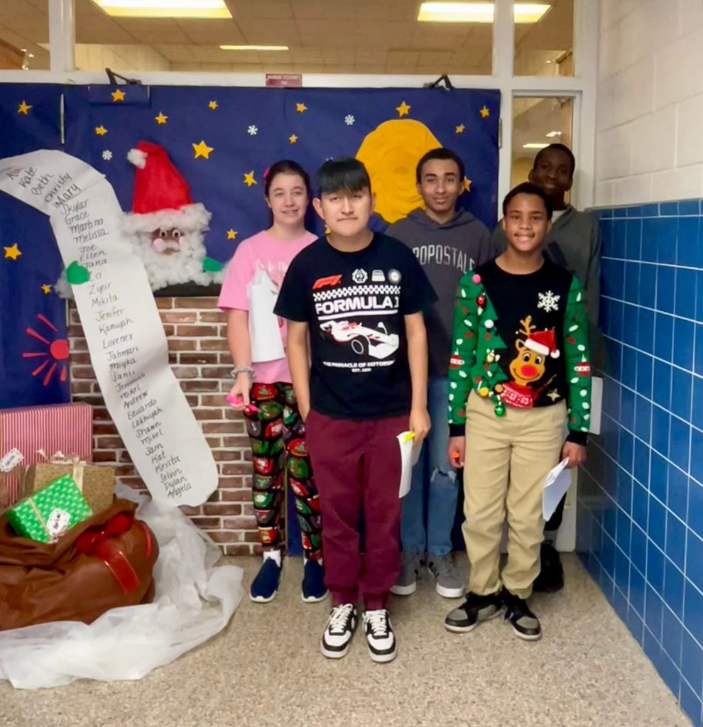 Students in front of holiday decorations