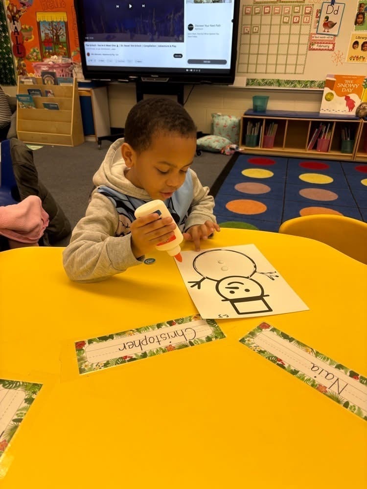 Student Gluing Snowman