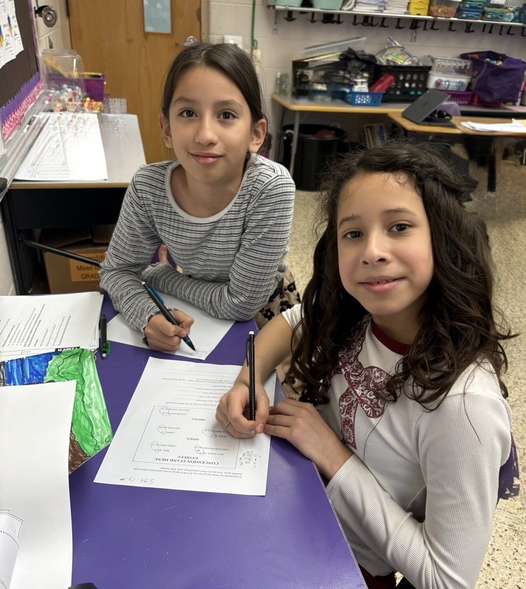 Girls collaborating on Math Worksheet