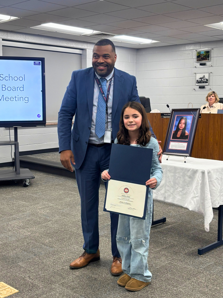 Superintendent Posing with Student