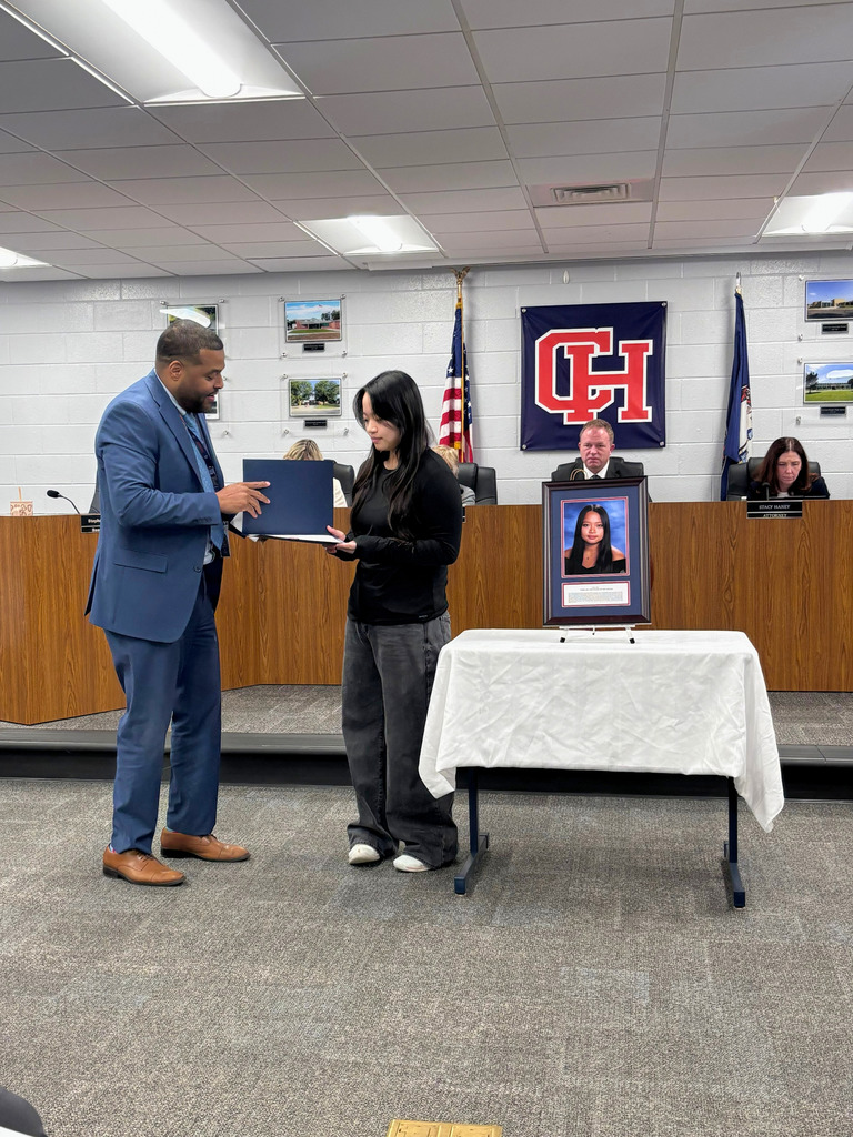 Superintendent Handing Student an Award