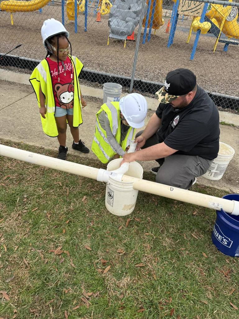 PreK Students building with PVC Pipes