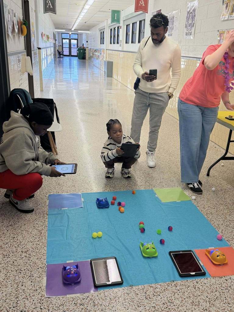 Students Playing with Robots