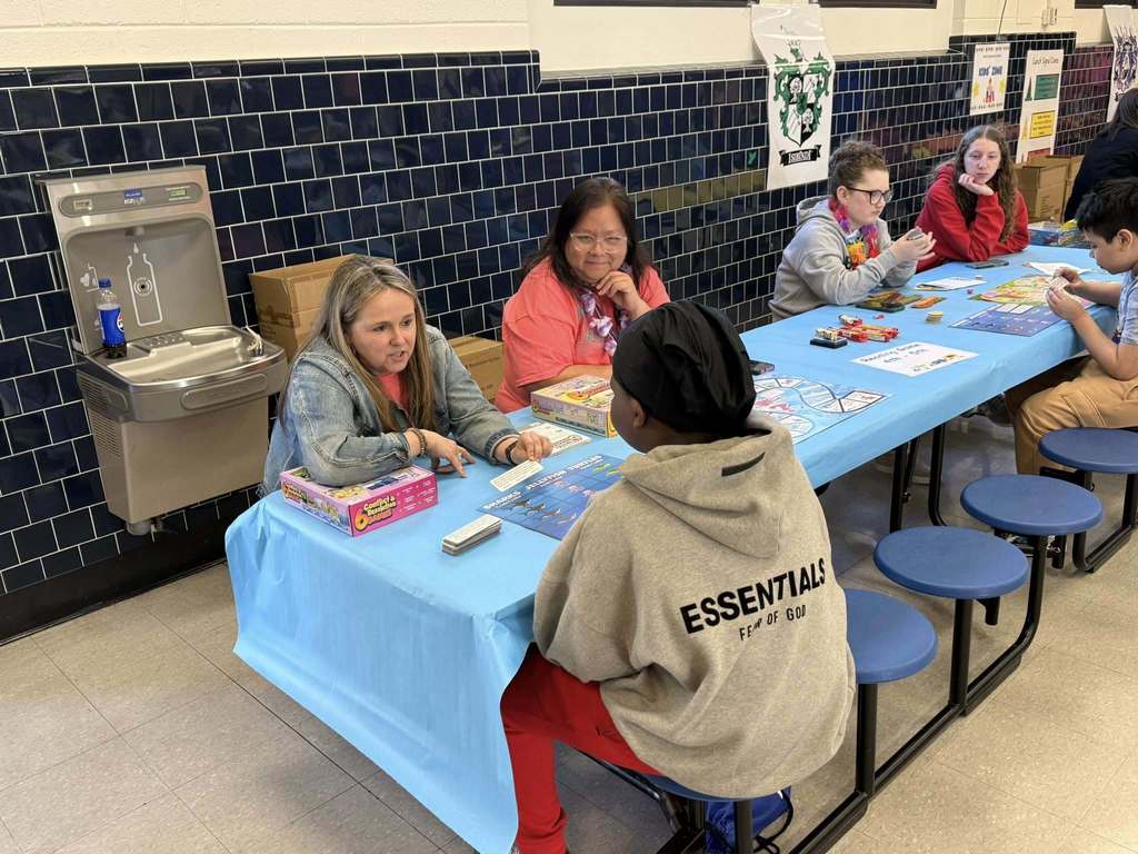 Student Playing Literacy Game with Teacher