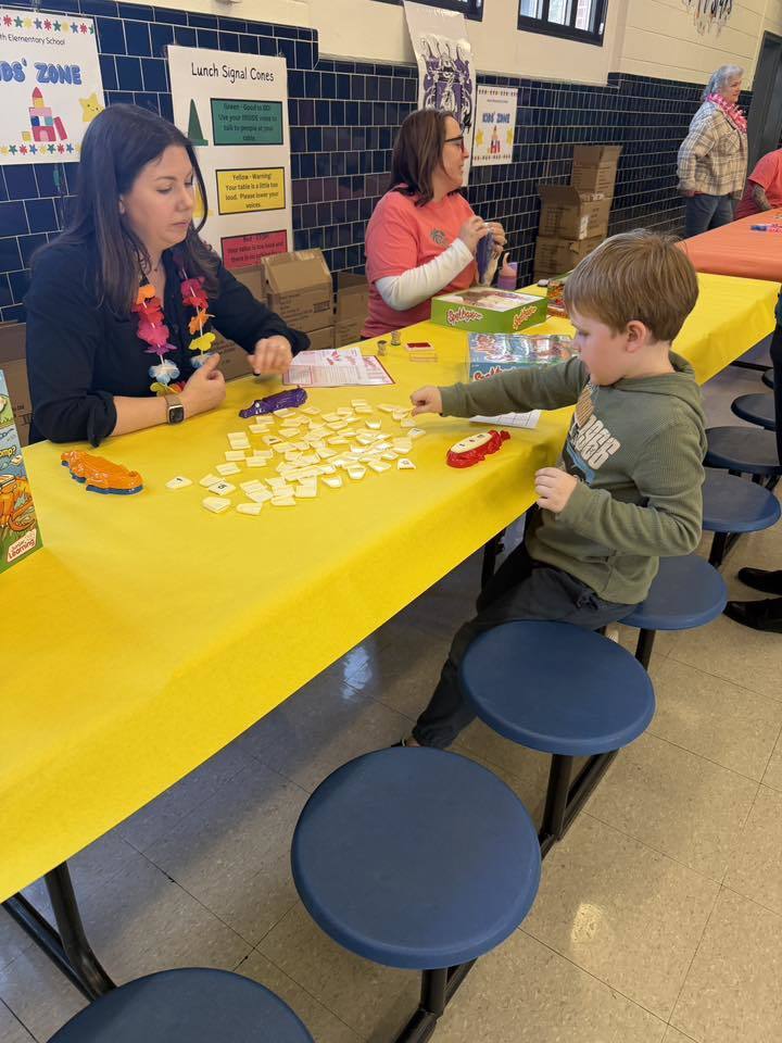 Boy playing Word game with teacher
