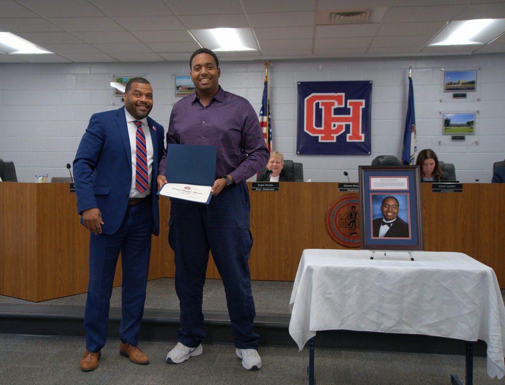 Superintendent with Student with Certificate of Achievement