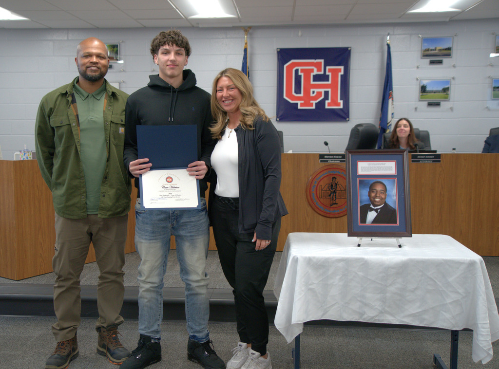 Boy with Family with Certificate of Achievement