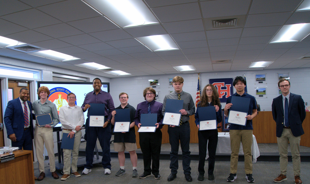 Quiz Bowl Students with Superintendent with Certificates of Achievement