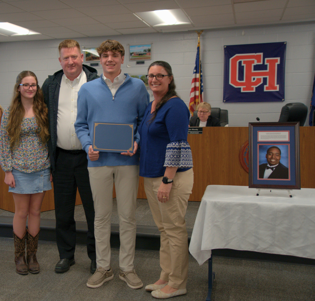 Boy with Family with Certificate of Achievement
