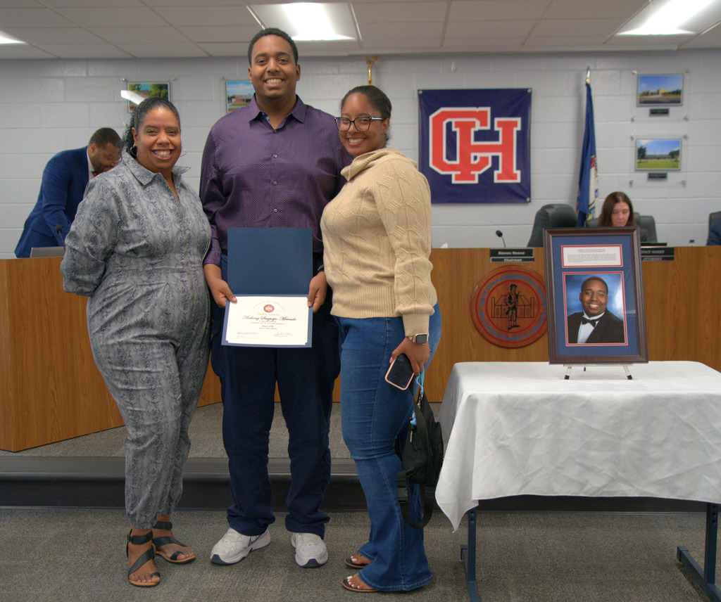 Student with Family with Certificate of Achievement