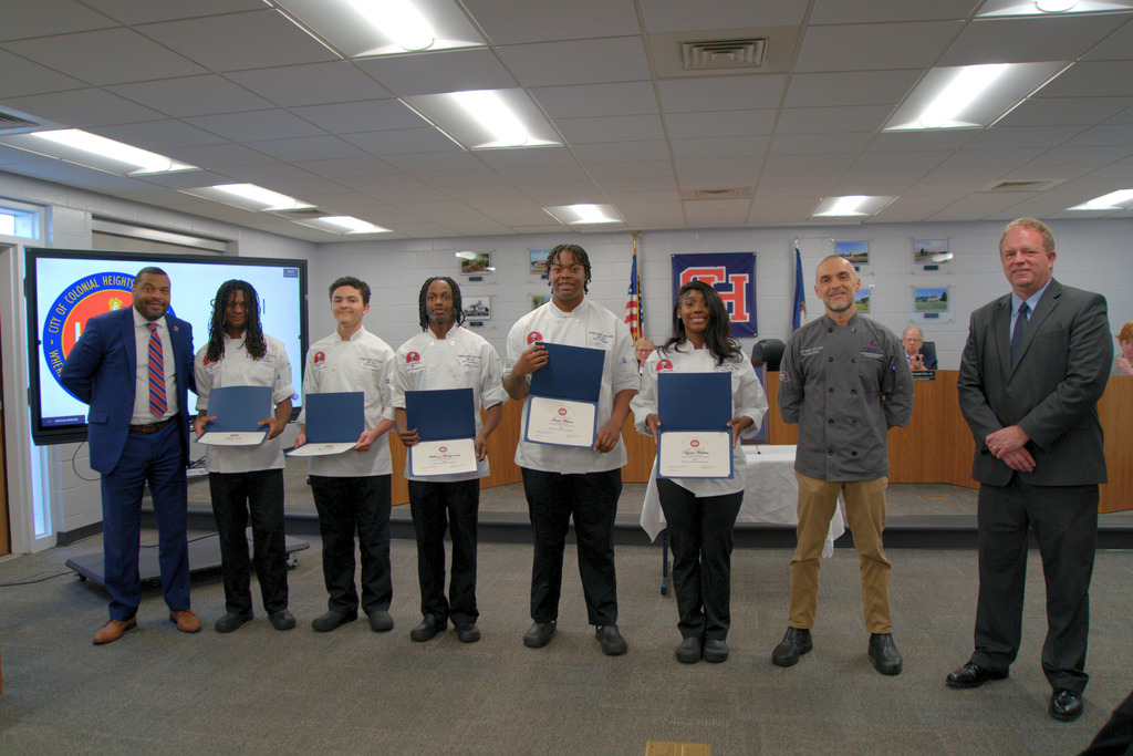 Culinary Students with Superintendent ,Teacher and Board Chair
