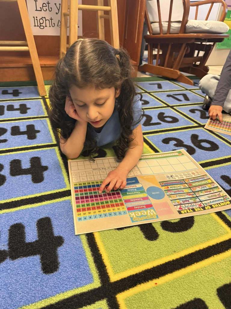 Girl working with math mat
