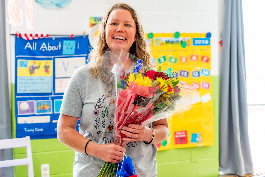 Shannon Waller, Office of Support Services winner with flowers