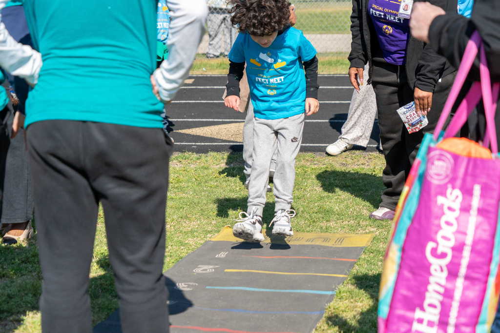 Student doing long jump event
