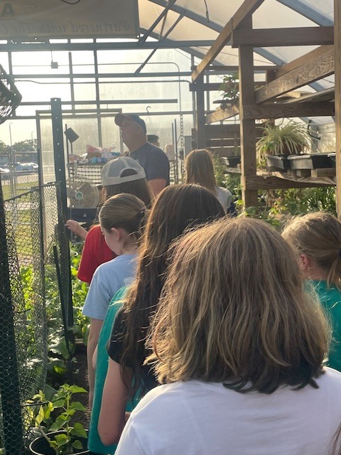 Bio Teacher Giving Girl Scouts Tour