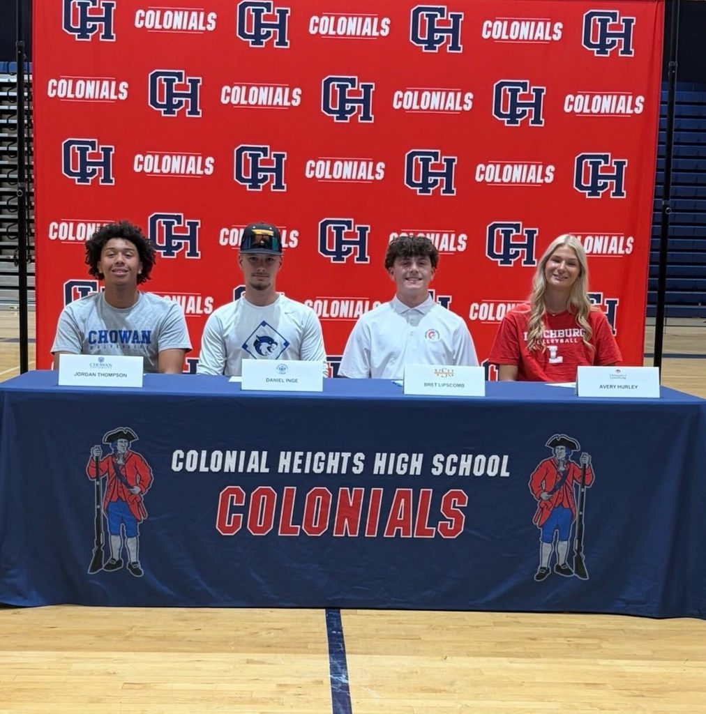 Seniors at College Signing Table