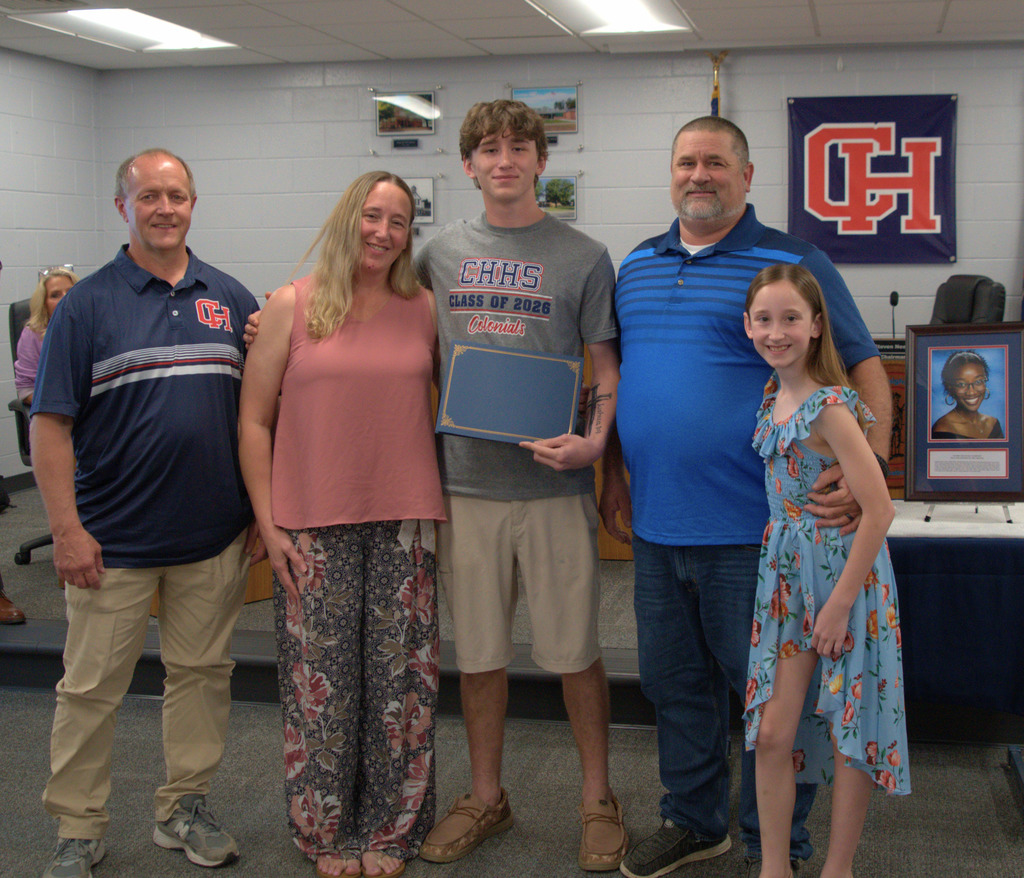 Wrestler with family and coach