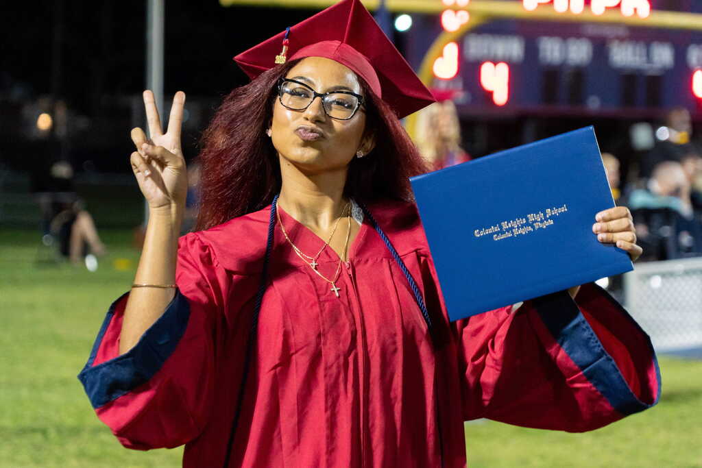 Girl with diploma posing