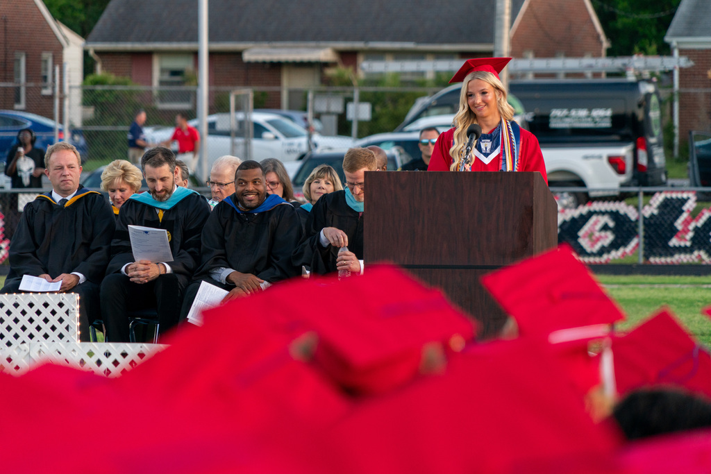 Class president at lecturn giving speech 