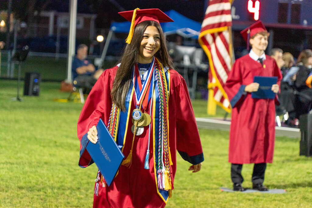 Girl with diploma walking