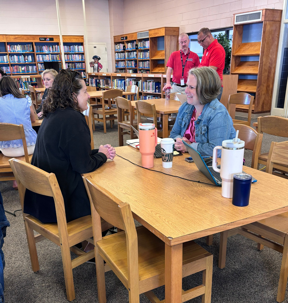 Leaders Collaboating at Tables 